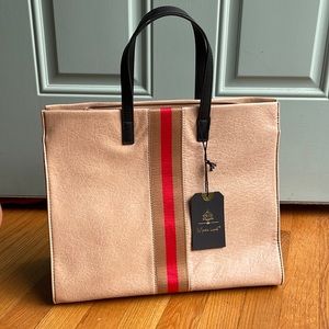 Faux leather Moda Luxe Tote with zip closure and fully lined interior.